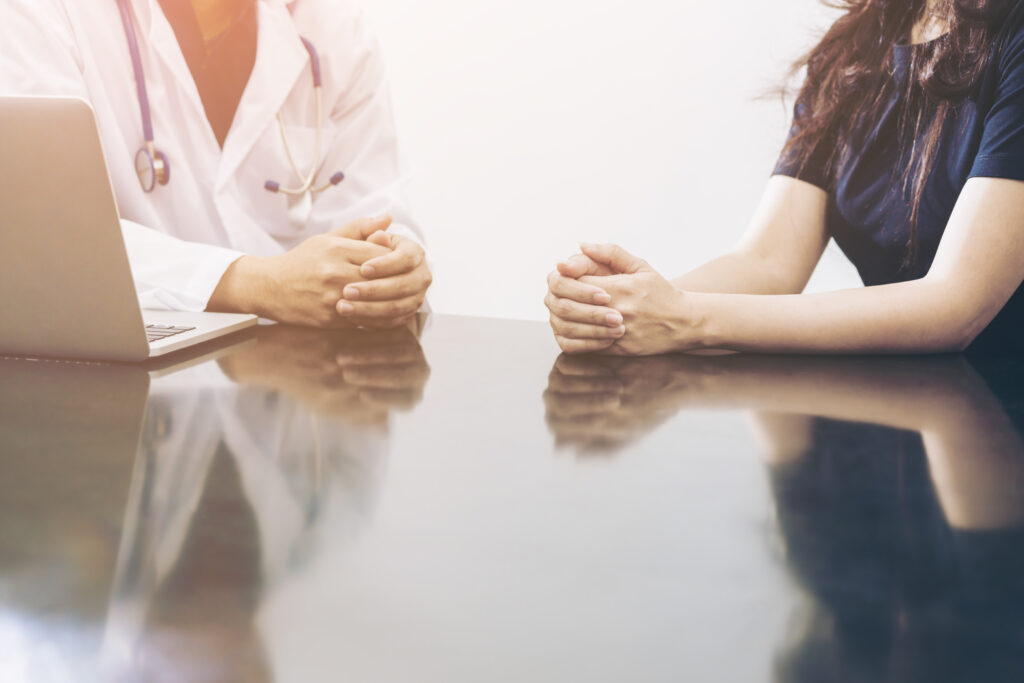 A provider talking to a patient about heavy metal testing in Miami