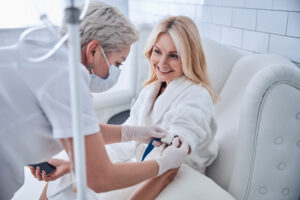 A woman receiving NAD+ IV therapy in Coral Gables, FL